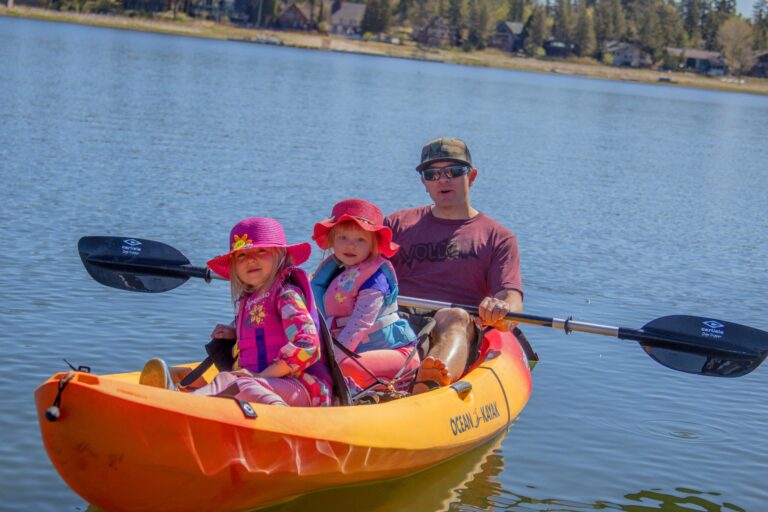 Family with two young children on a kayak in Big Bear Lake, CA