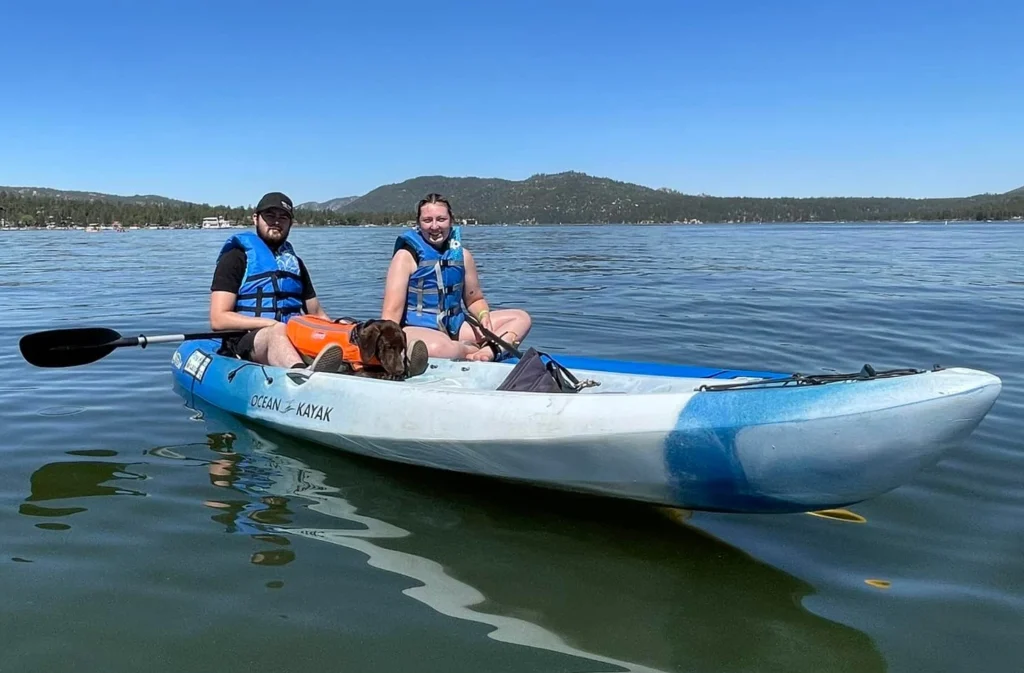 Pet-friendly Big Bear kayak rental with two adults and dog on Big Bear Lake