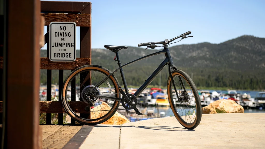 Bike sitting near a bridge and marina of Big Bear Lake rented from Big Bear Bike Rentals