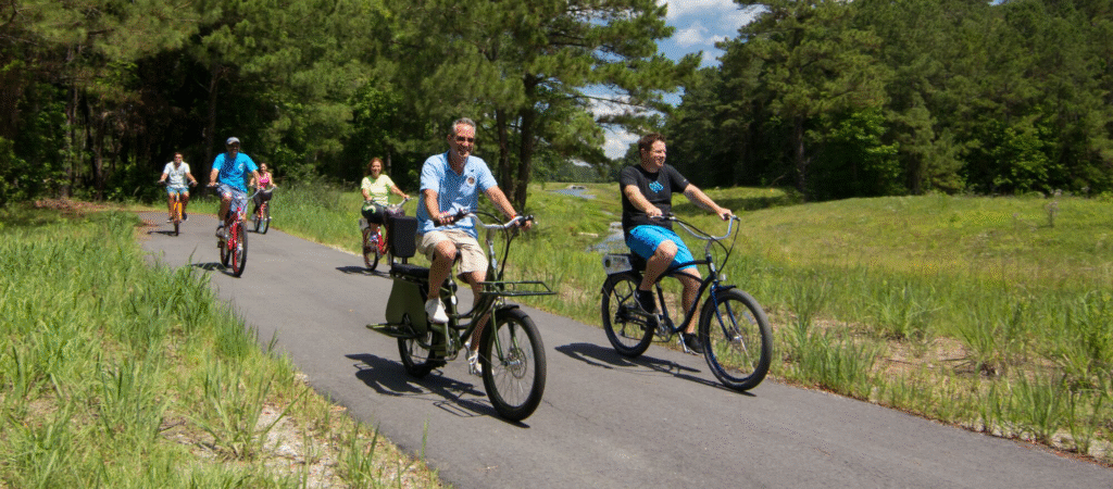 Big Bear Bike Rentals customers and family riding along path in Big Bear